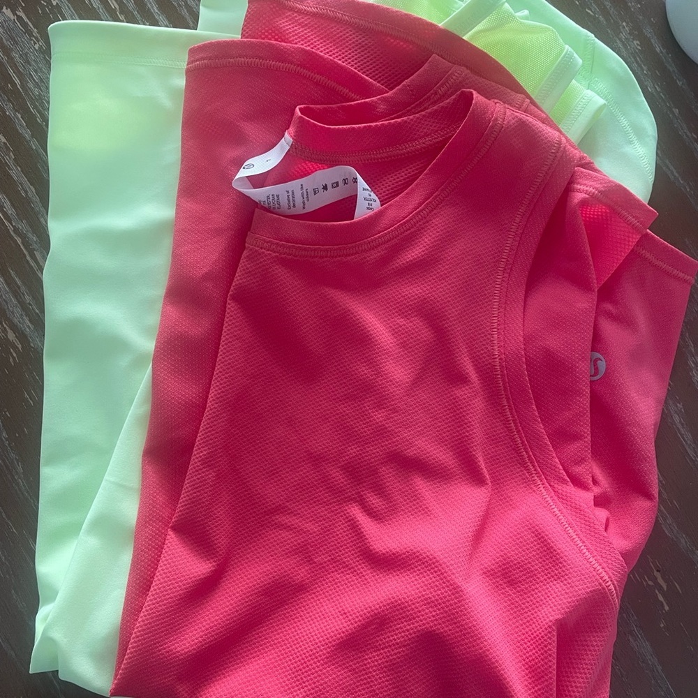 Two never worn lululemon women’s athletic tank. Size 4